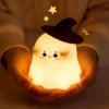Cute Ghost Night Light with soft warm LED glow and silicone body, perfect for bedroom décor, nursery, bedside table, and cozy room lighting. Cute Ghost Night Light with soft warm LED glow and silicone body, perfect for bedroom décor, nursery, bedside table, and cozy room lighting.