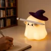 Cute Ghost Night Light with soft warm LED glow and silicone body, perfect for bedroom décor, nursery, bedside table, and cozy room lighting. Cute Ghost Night Light with soft warm LED glow and silicone body, perfect for bedroom décor, nursery, bedside table, and cozy room lighting.