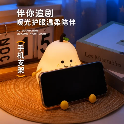 Cute pear silicone LED night light with soft warm glow, adorable character design for kids' bedrooms, nurseries, bedside tables and cozy décor Cute pear silicone LED night light with soft warm glow, adorable character design for kids' bedrooms, nurseries, bedside tables and cozy décor