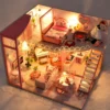 Pink miniature DIY dollhouse with warm LED lights Pink miniature DIY dollhouse with warm LED lights