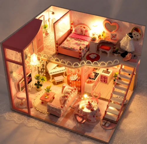 Pink miniature DIY dollhouse with warm LED lights Pink miniature DIY dollhouse with warm LED lights
