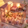 Pink miniature DIY dollhouse with warm LED lights Pink miniature DIY dollhouse with warm LED lights