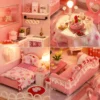 Pink miniature DIY dollhouse with warm LED lights Pink miniature DIY dollhouse with warm LED lights