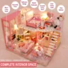 Pink miniature DIY dollhouse with warm LED lights Pink miniature DIY dollhouse with warm LED lights