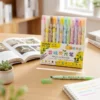 12 Colors Fruit Scented Highlighter Set with pastel highlighter pens in a storage box for studying, journaling, note-taking, and office use. 12 Colors Fruit Scented Highlighter Set with pastel highlighter pens in a storage box for studying, journaling, note-taking, and office use.