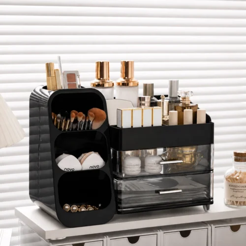 Multi-compartment desk organizer with drawers holding notebooks, pens, markers, scissors, stationery and craft supplies