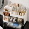 Multi-compartment desk organizer with drawers holding notebooks, pens, markers, scissors, stationery and craft supplies
