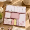 Kawaii floral weekly planner sticky notes set with memo pads, page markers, to-do list, and pastel stationery arranged on a wooden desk. Kawaii floral weekly planner sticky notes set with memo pads, page markers, to-do list, and pastel stationery arranged on a wooden desk.