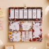 Vintage Floral Weekly Planner Sticky Notes Set with memo pads, page markers, and botanical sticky notes arranged on a wooden desk. Vintage Floral Weekly Planner Sticky Notes Set with memo pads, page markers, and botanical sticky notes arranged on a wall.