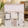 Minimalist Marble Weekly Planner Sticky Notes Set with memo pads, page markers, and weekly planner on a wooden desk. Minimalist Marble Weekly Planner Sticky Notes Set with memo pads, page markers, and weekly planner on a wooden desk.
