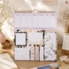 Minimalist Marble Weekly Planner Sticky Notes Set with memo pads, page markers, and weekly planner on a wooden desk. Minimalist Marble Weekly Planner Sticky Notes Set with memo pads, page markers, and weekly planner on a wooden desk.