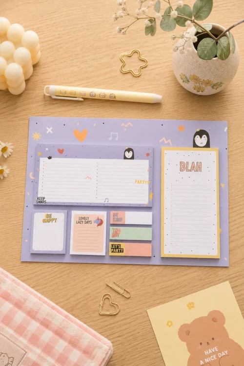 Cute Penguin Sticky Notes Planner Set with weekly planner, to-do list, memo pads, sticky notes, and page markers on a wooden desk.