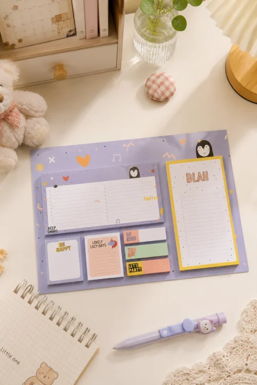 Cute Penguin Sticky Notes Planner Set with weekly planner, to-do list, memo pads, sticky notes, and page markers on a wooden desk.