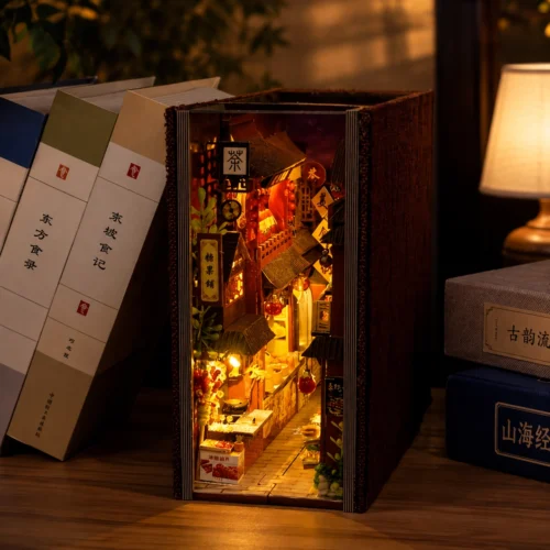 Miniature building block kit featuring a detailed Chinese food street with tiny shops, food stalls, lanterns and street décor