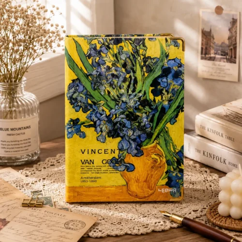 Van Gogh notebook with blue iris floral artwork on a yellow hardcover