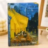 Van Gogh Night Café notebook with blue and yellow café artwork on the hardcover