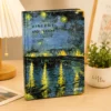 Van Gogh Café Terrace Notebook featuring blue and yellow night café artwork on the cover Van Gogh Café Terrace Notebook featuring blue and yellow night café artwork on the cover