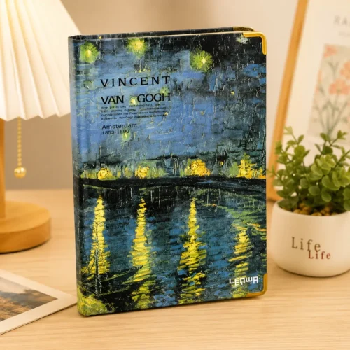 Van Gogh Café Terrace Notebook featuring blue and yellow night café artwork on the cover Van Gogh Café Terrace Notebook featuring blue and yellow night café artwork on the cover