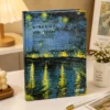 Van Gogh Café Terrace Notebook featuring blue and yellow night café artwork on the cover Van Gogh Café Terrace Notebook featuring blue and yellow night café artwork on the cover